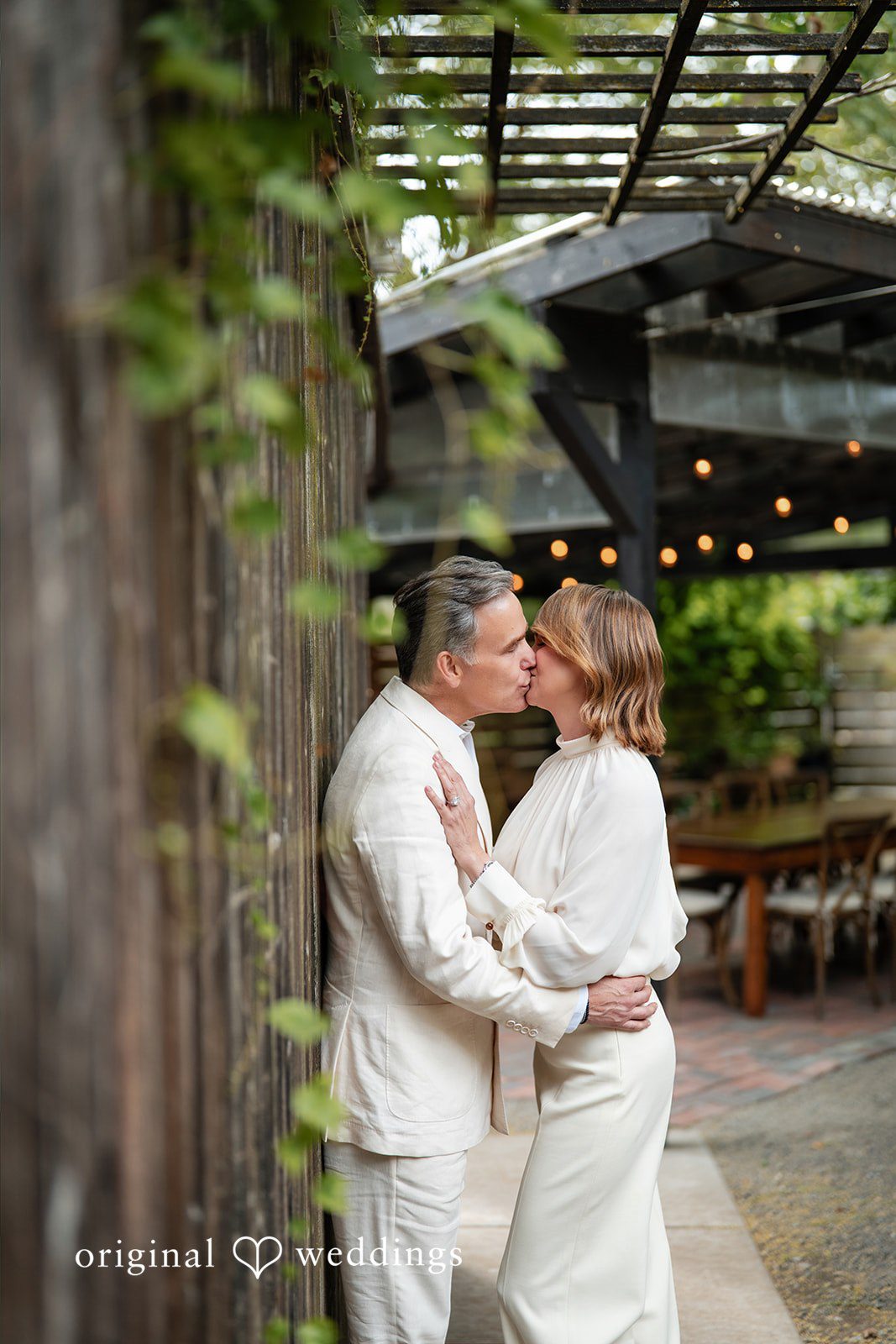 Jennifer + Justin The couple shares a kiss