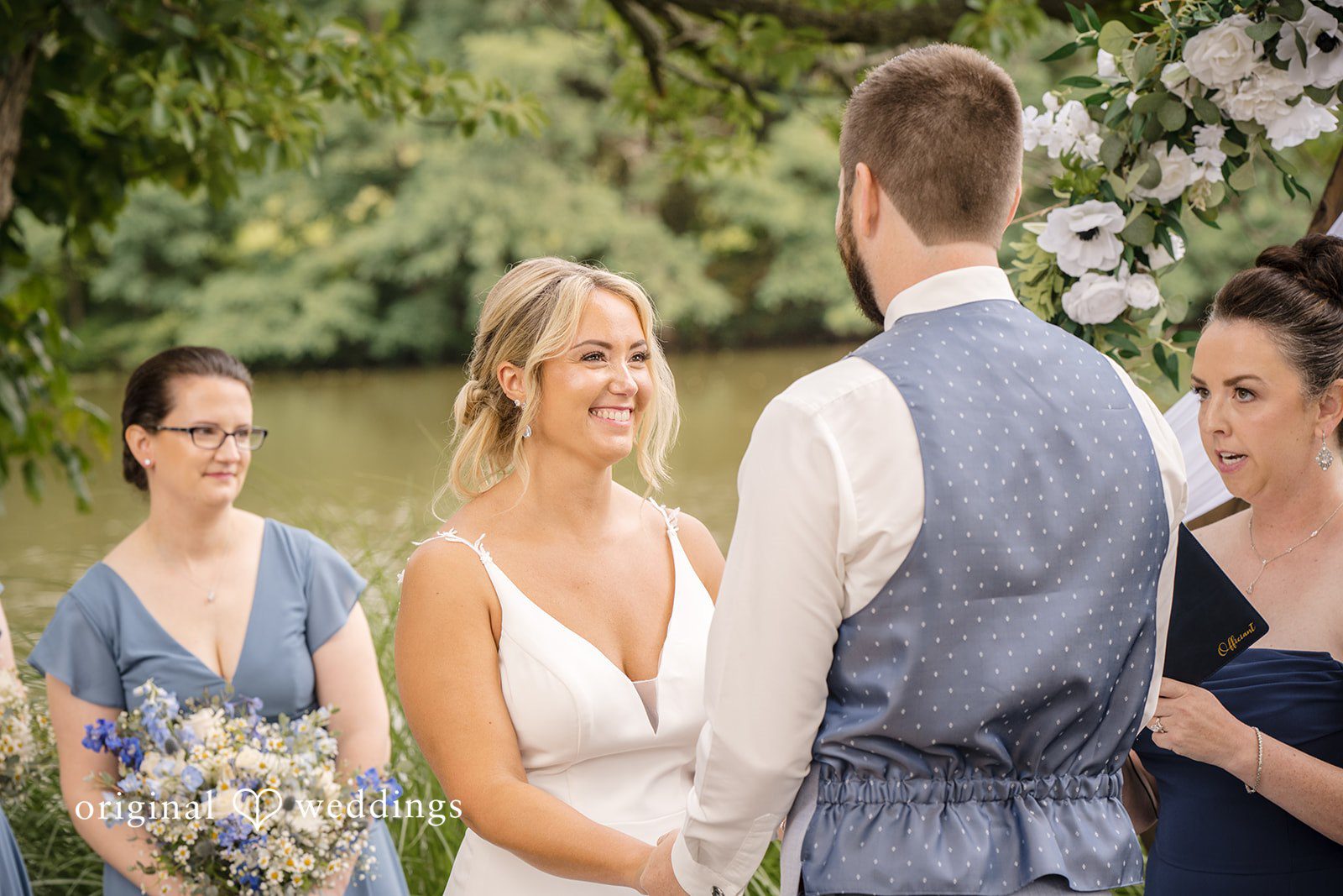 Morgan + Colin A bride and groom looking lovingly at each other during their wedding ceremony.