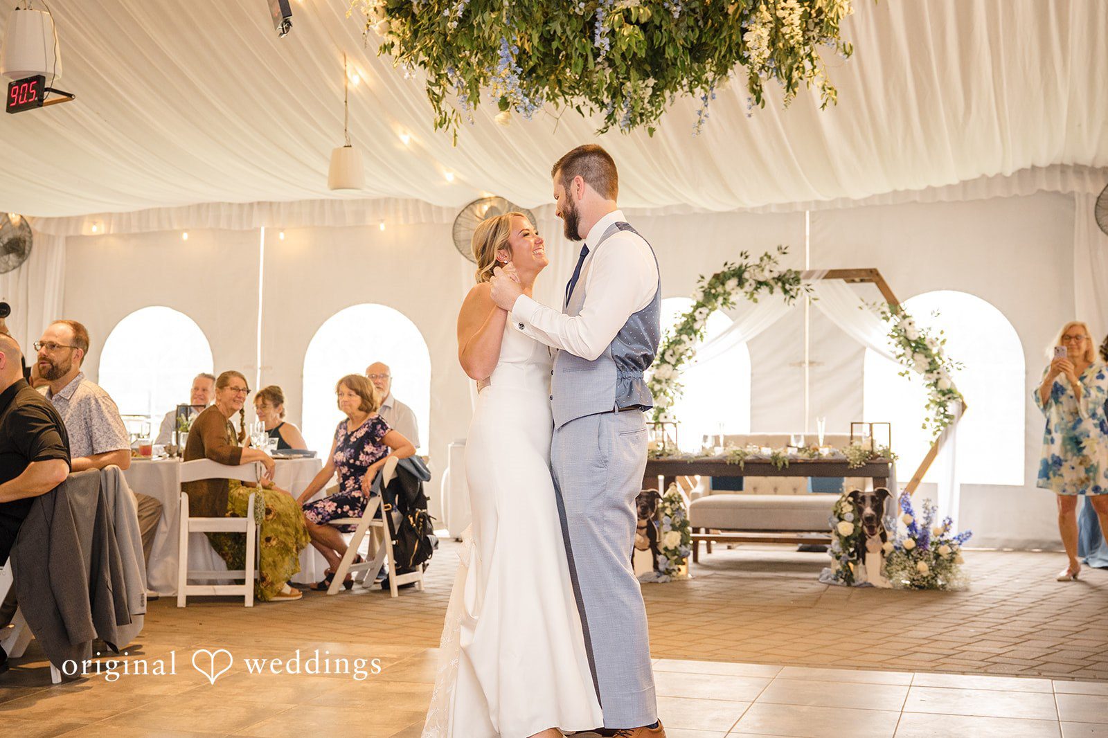 Morgan + Colin A bride and groom sharing their first dance in front of seated reception guests.