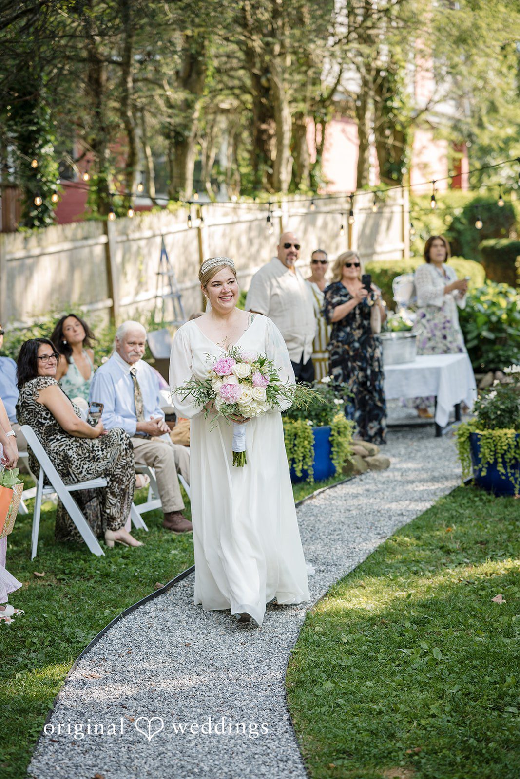 Alice-sun + Michael Lovely bride walking down the aisle holding bouquet