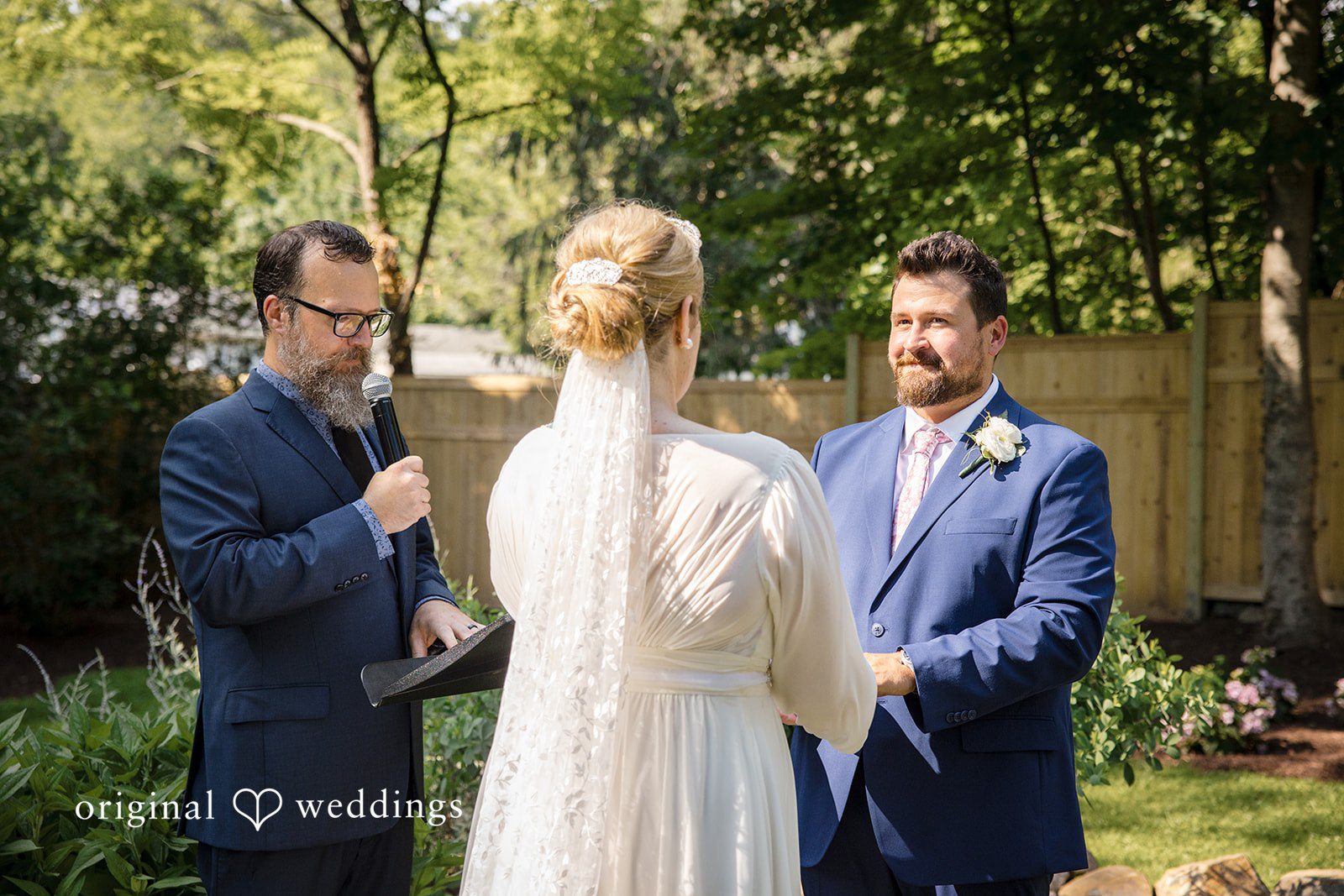 Alice-sun + Michael Bride and groom looking at each other with pure love during wedding ceremony, hands in hands