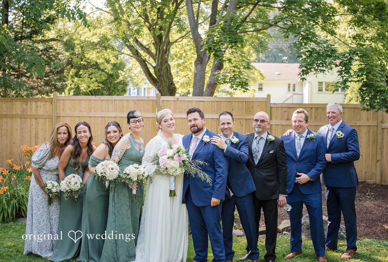 NYC wedding photography by Original Weddings capturing the group picture of couple with the bridesmaids and groomsmen