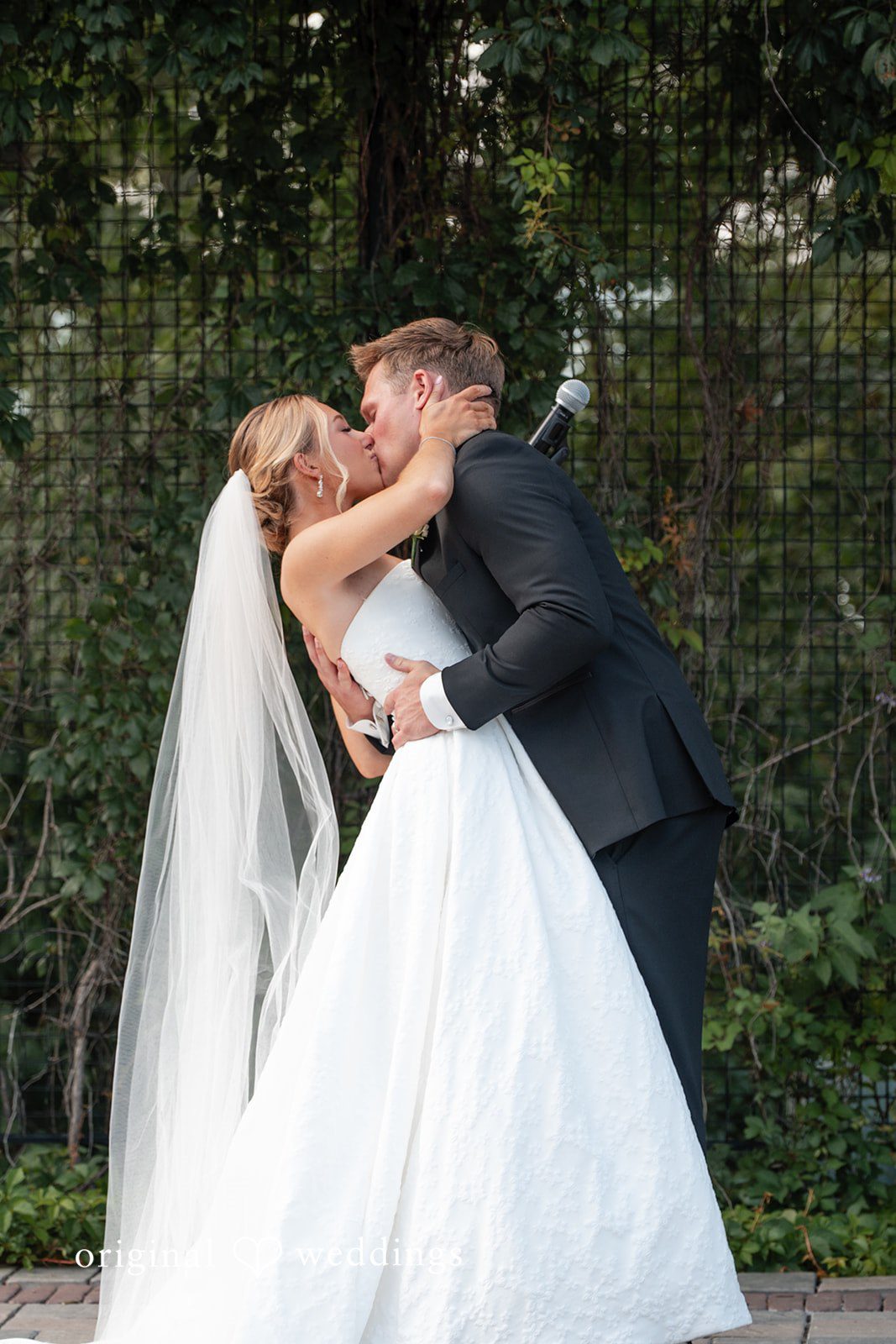 Nikki + Charlie The couple shares a kiss