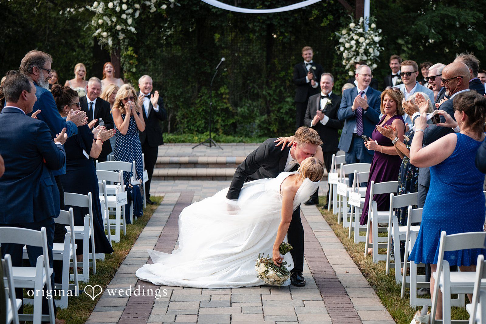 Nikki + Charlie A passionate kiss on the aisle