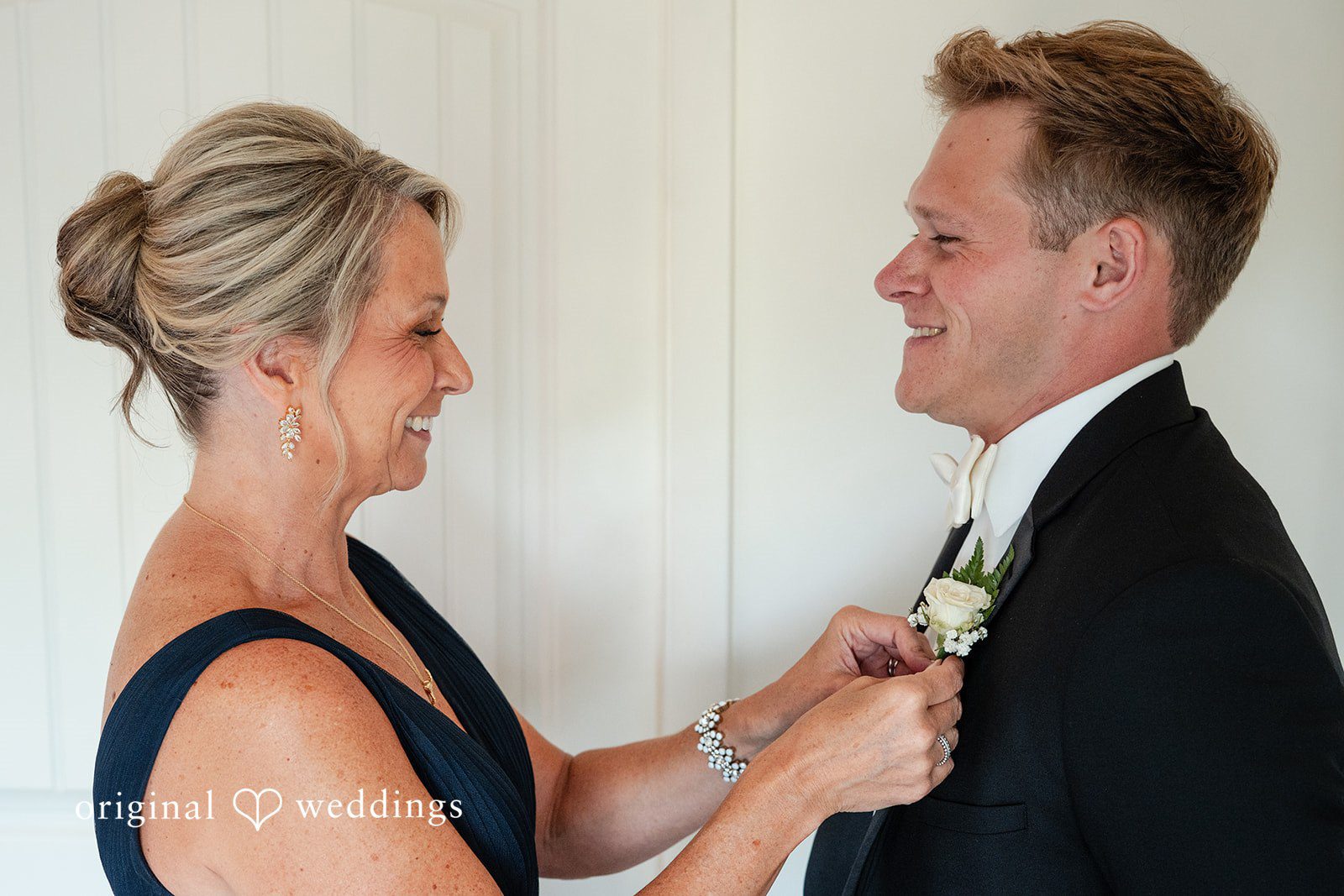 Nikki + Charlie The groom's mum helps groom get prepared