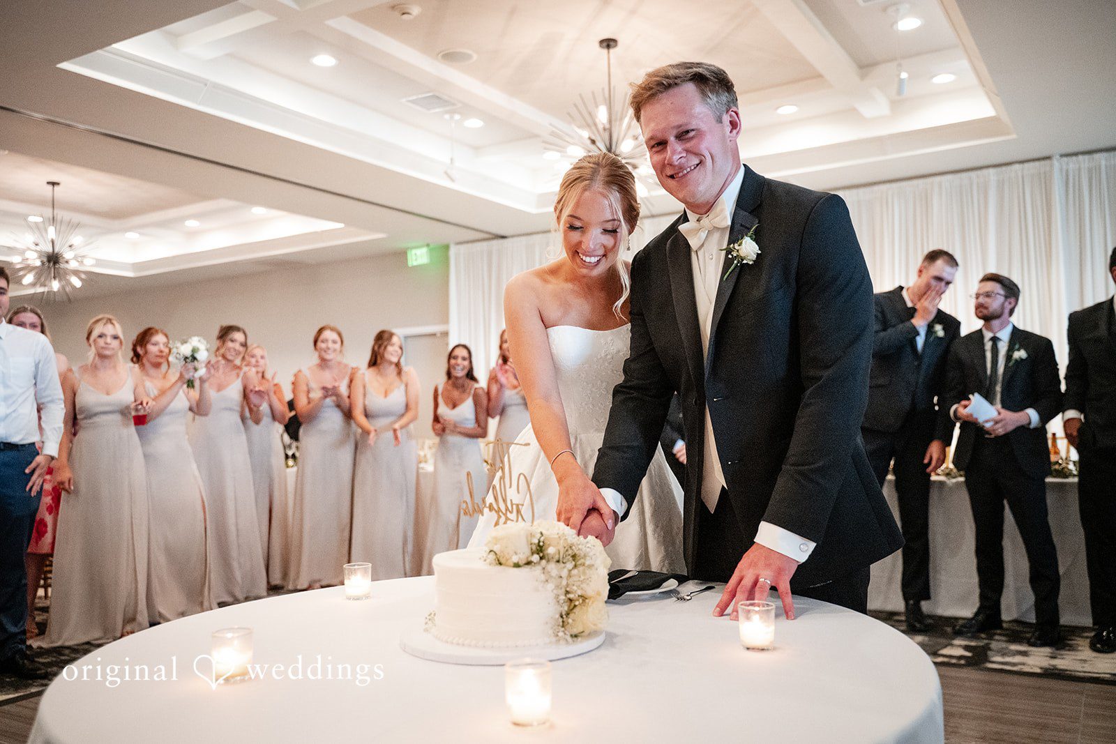 Nikki + Charlie The couple cuts their wedding cake