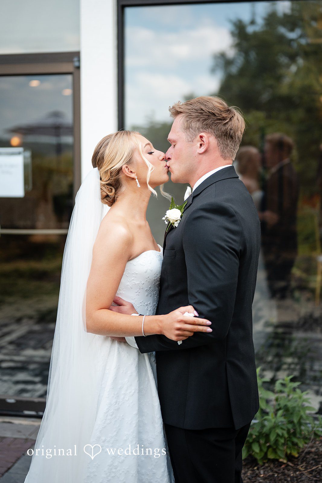 Nikki + Charlie The couple shares a romantic kiss