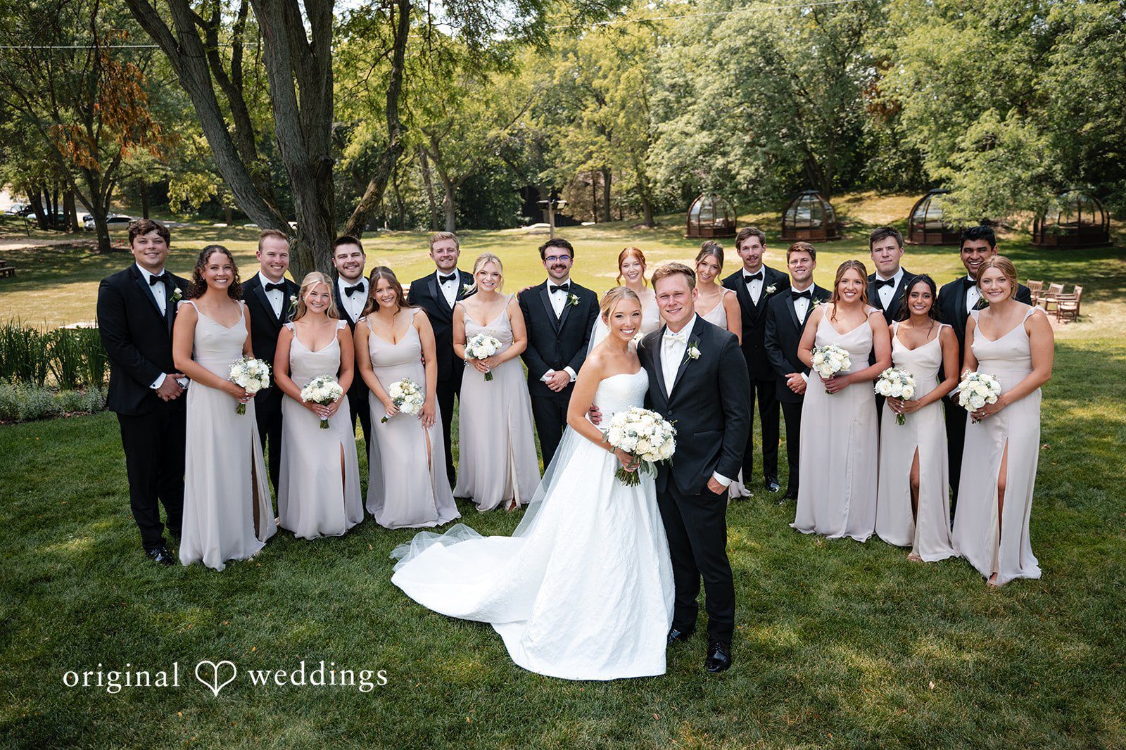 Our Milwaukee wedding photographers at Original Weddings captured a stunning portrait of the couple and their wedding party at The Lodge Geneva National