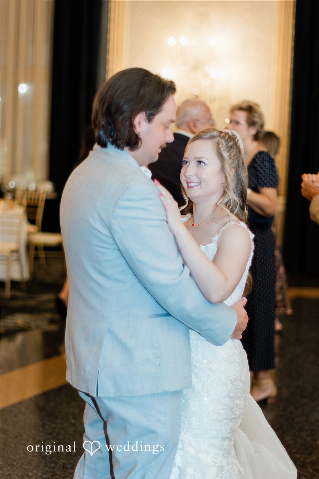 Sara + Michael A bride and groom sharing a close, smiling embrace on the dance floor.