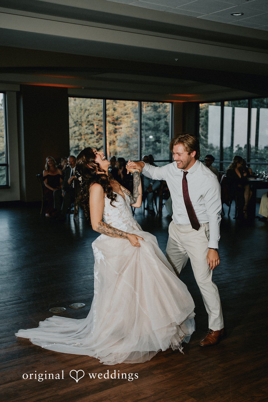 Jennifer + Danielle A bride and man dance and celebrate on the reception dance floor.