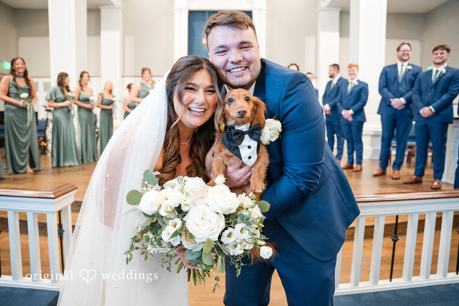 Chelsea + Matthew Bride and groom posing with their dog at The Rivulet