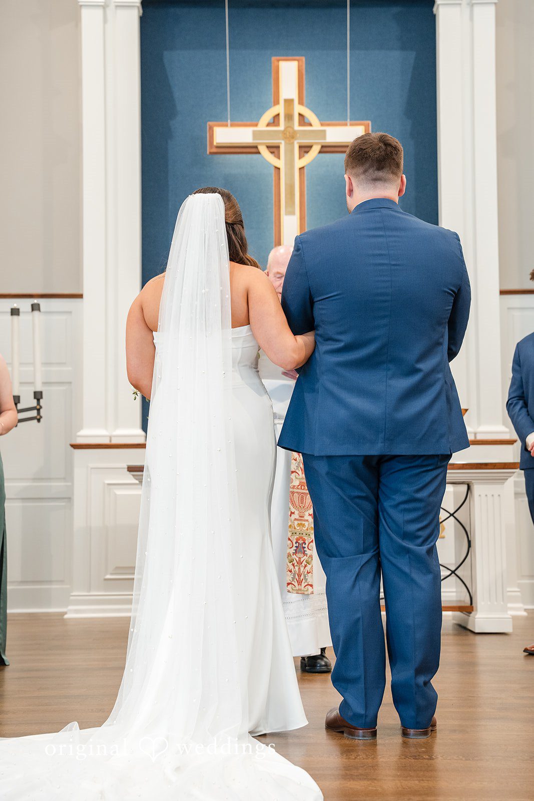 Chelsea + Matthew Bride and groom standing together infront of priest at The Rivulet