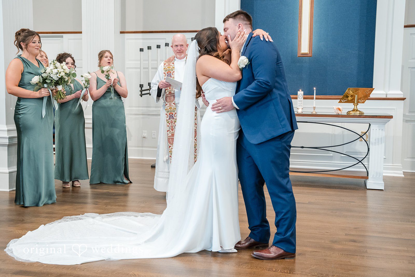 Chelsea + Matthew Newlyweds kissing during wedding ceremony at The Rivulet
