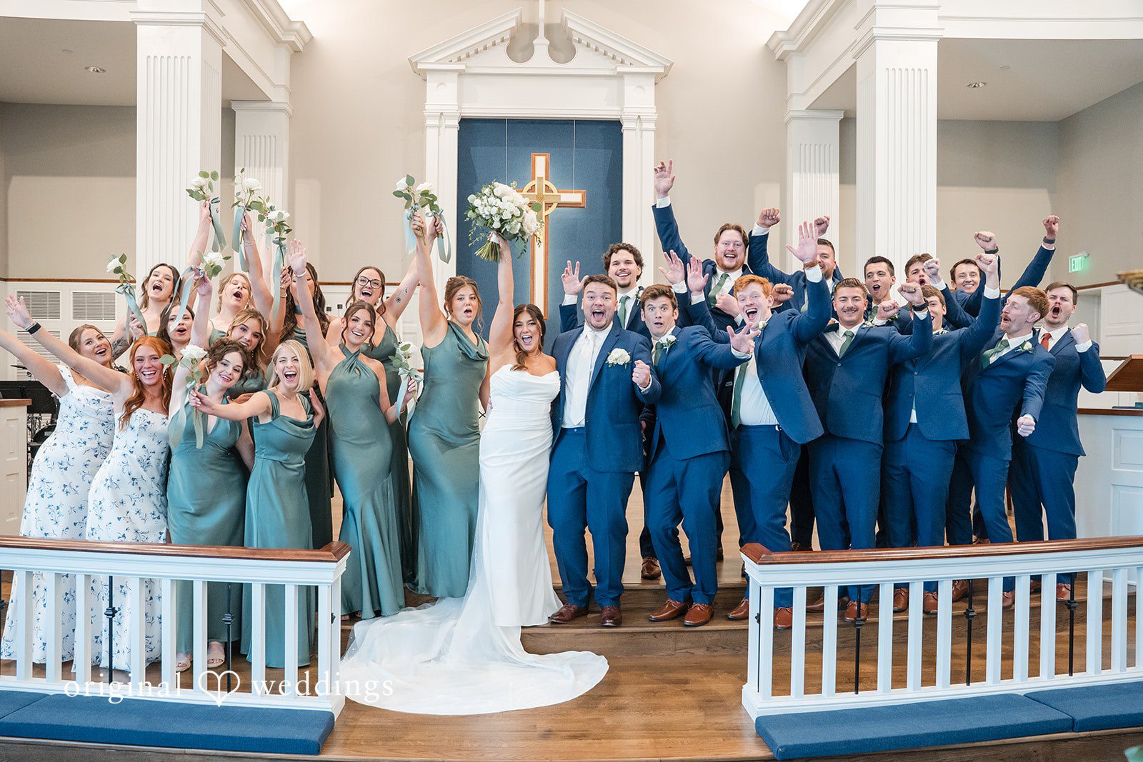 Chelsea + Matthew Milwaukee Wedding Photographers capturing couple group photo with bridesmaids and groomsmen at The Rivulet by Original Weddings