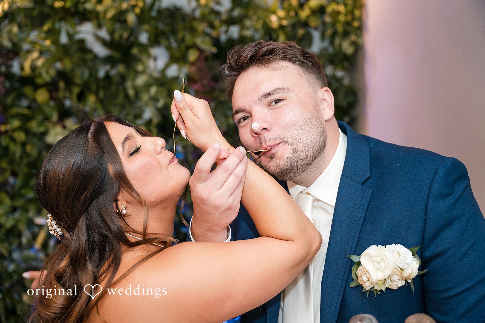 Chelsea + Matthew Bride and groom sharing cake moment at The Rivulet