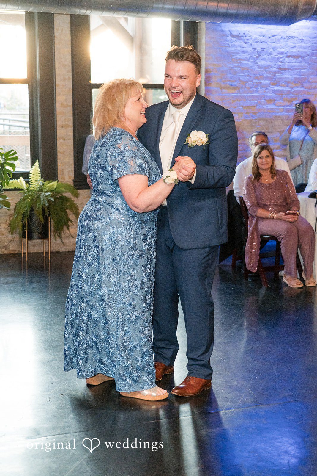 Chelsea + Matthew Groom enjoying reception dance with someone at The Rivulet