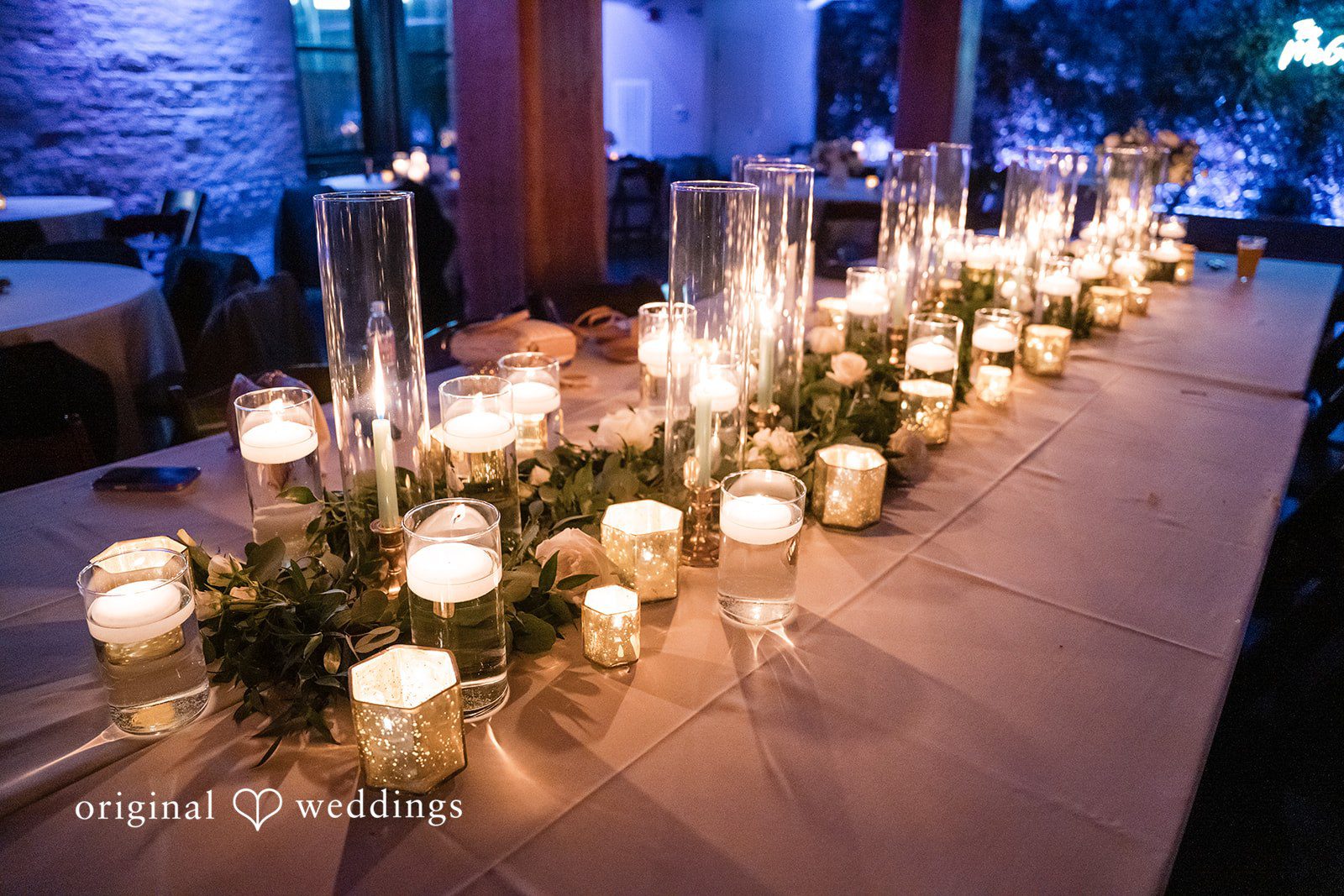 Chelsea + Matthew Beautiful floral and candle arrangement at The Rivulet