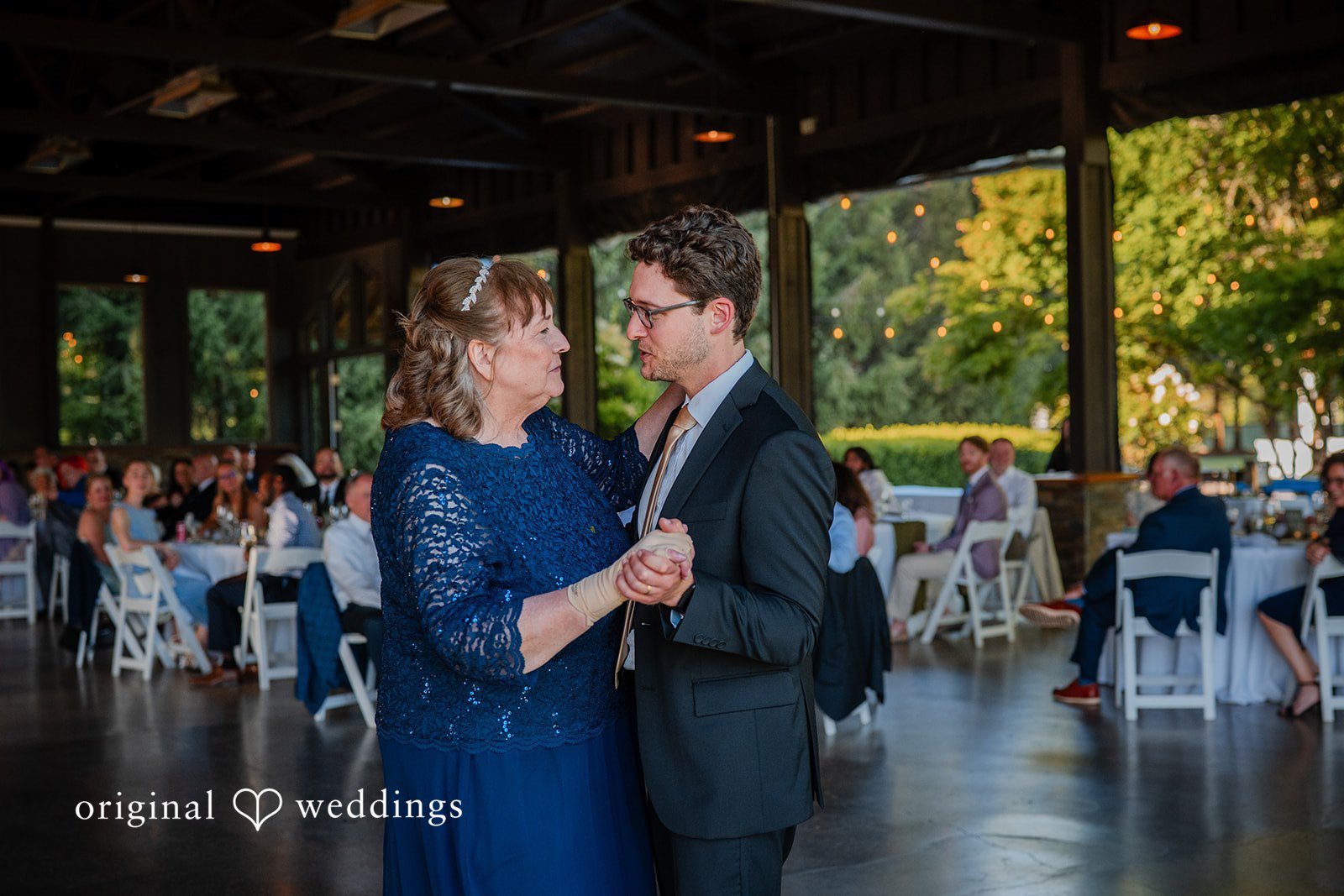 Zechariah + Tova A women and groom dancing together closely at a wedding reception.