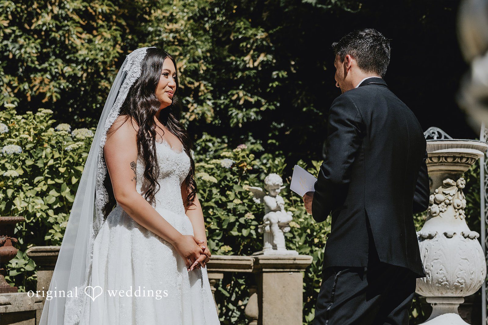 Sharmaine + Ronald A bride and groom standing together during their wedding ceremony.
