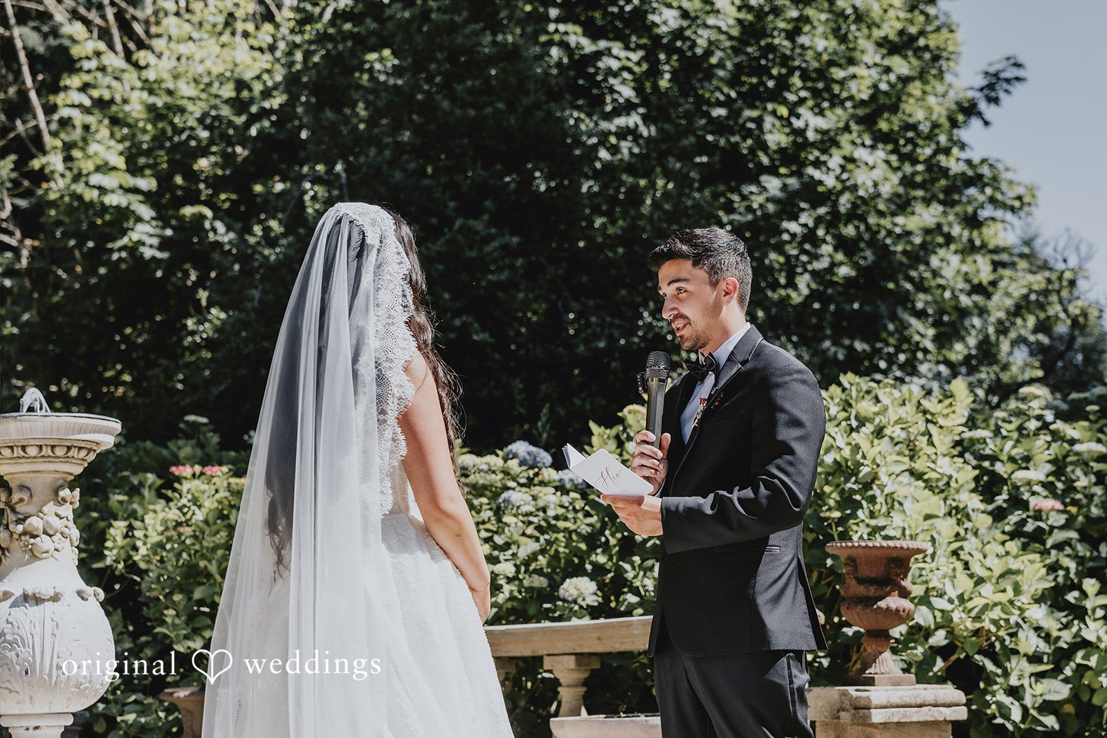 Sharmaine + Ronald A groom reading his vows to a bride during an altar ceremony.