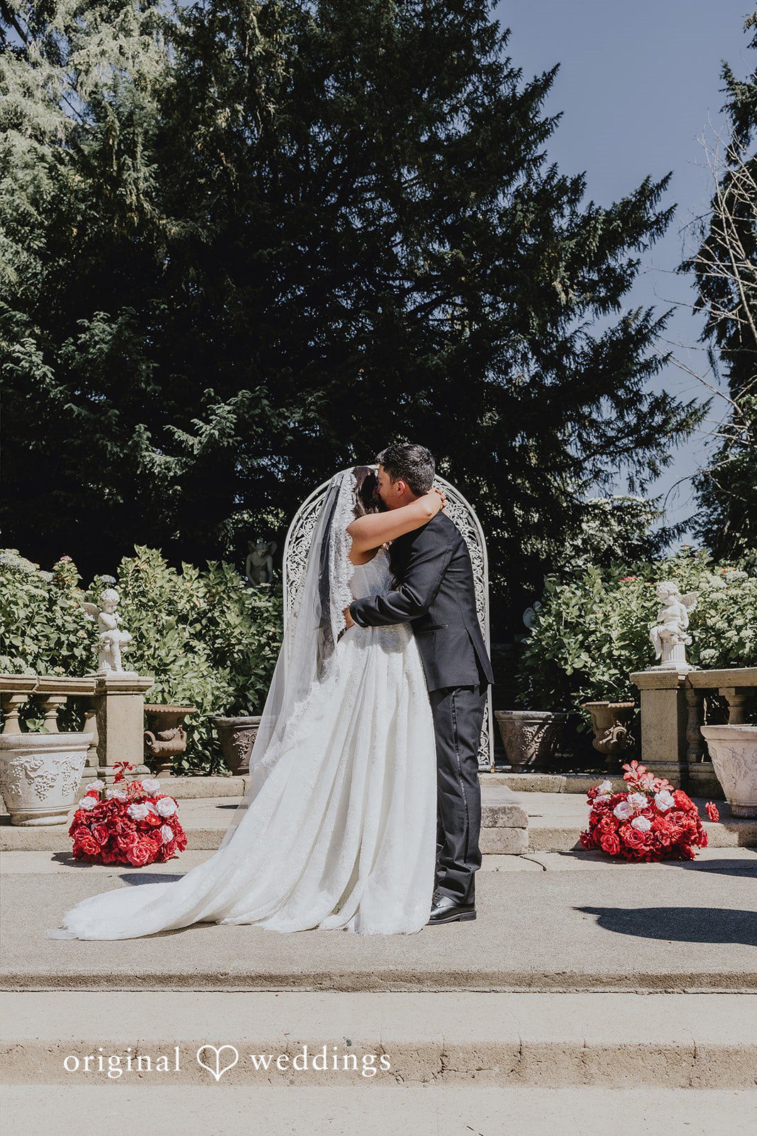 Sharmaine + Ronald A bride and groom sharing a close embrace during their wedding.