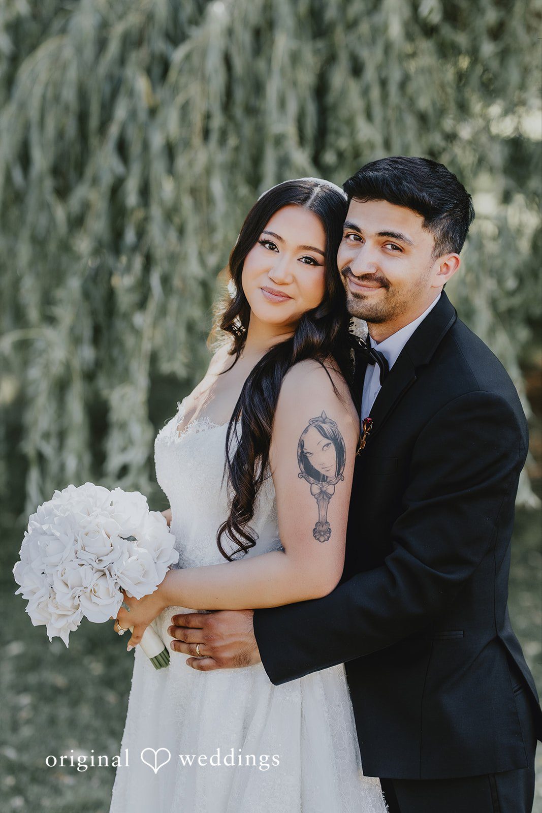 Sharmaine + Ronald A close-up portrait of a bride holding her bouquet next to a groom.