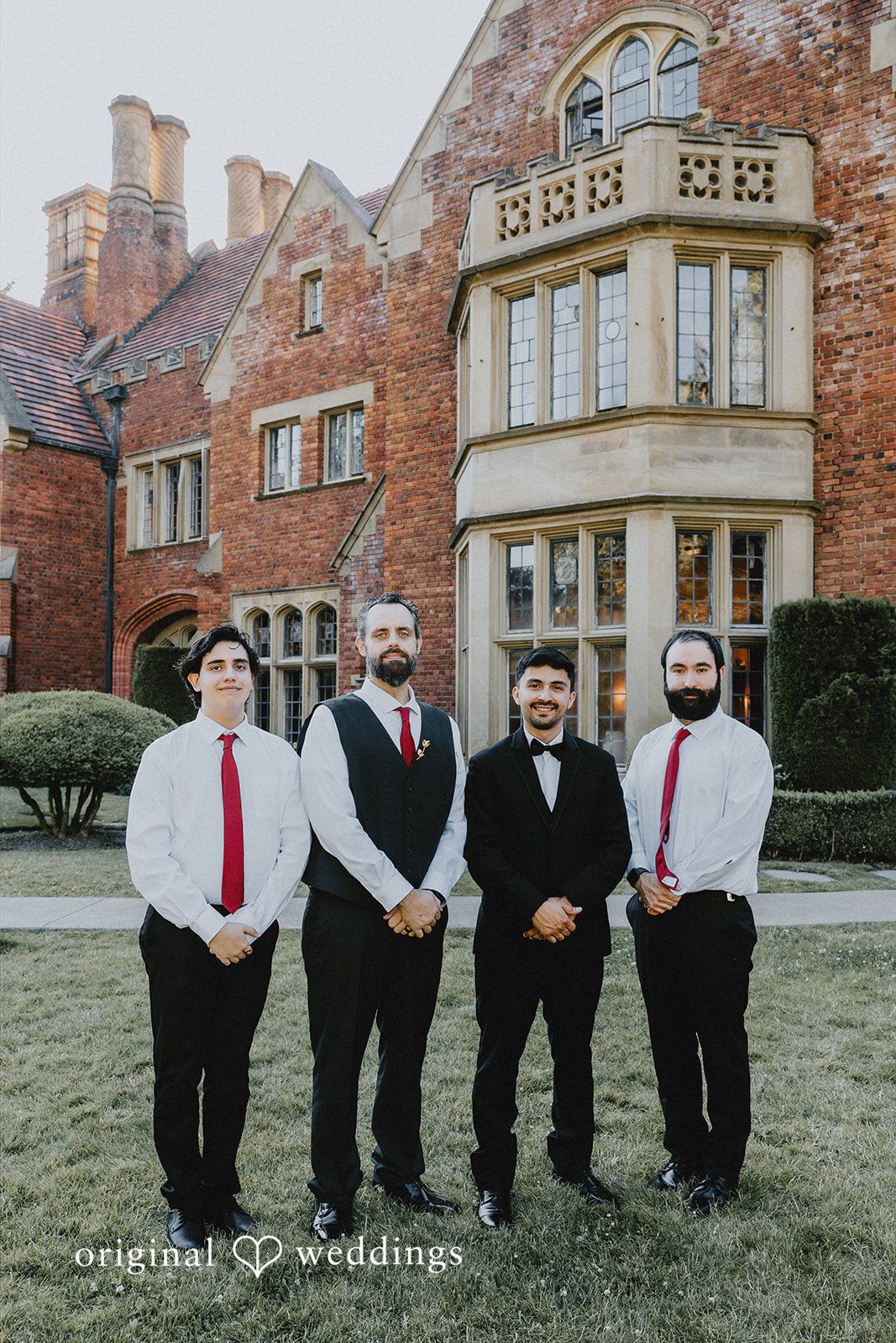 Sharmaine + Ronald A groom posing with his groomsmen dressed in matching black and white attire.