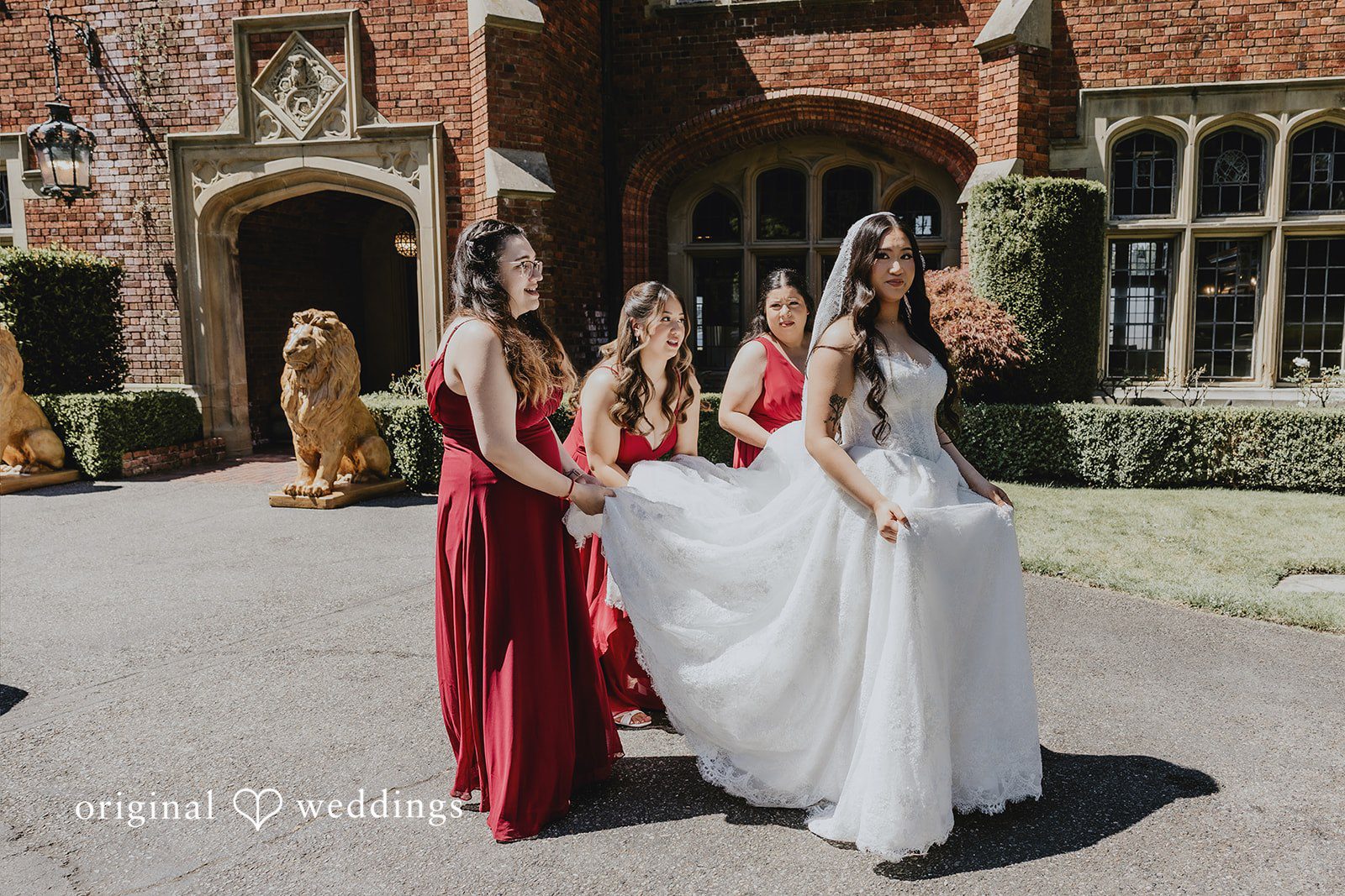 Sharmaine + Ronald A bride walking alongside bridesmaids in matching red dresses.