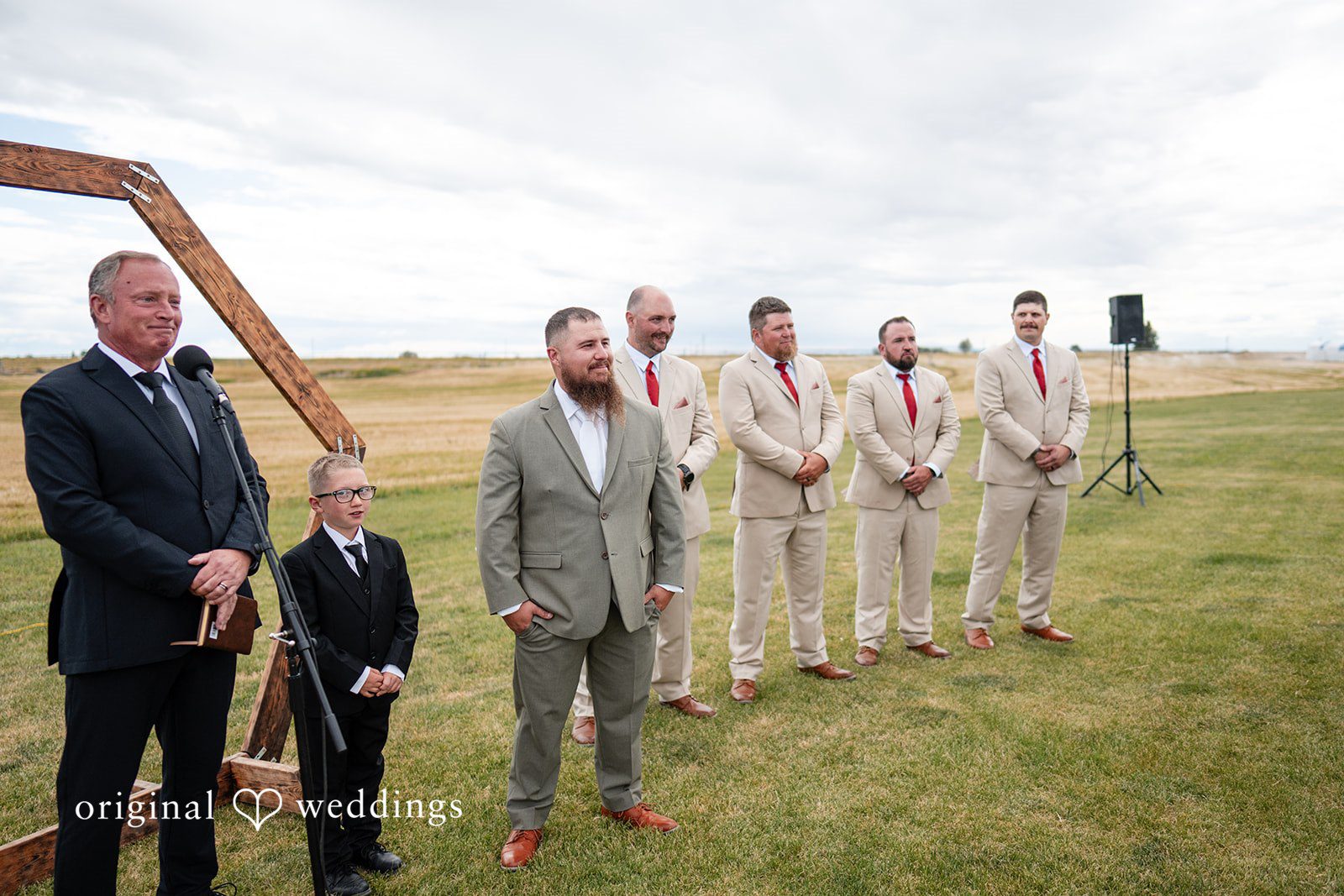 Kayla + Dillon A groom and his groomsmen standing in a line at the altar awaiting the ceremony.