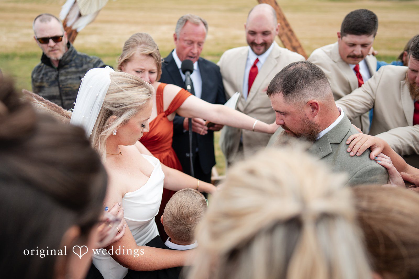 Kayla + Dillon A bride and groom celebrating with their wedding guests immediately following the ceremony.