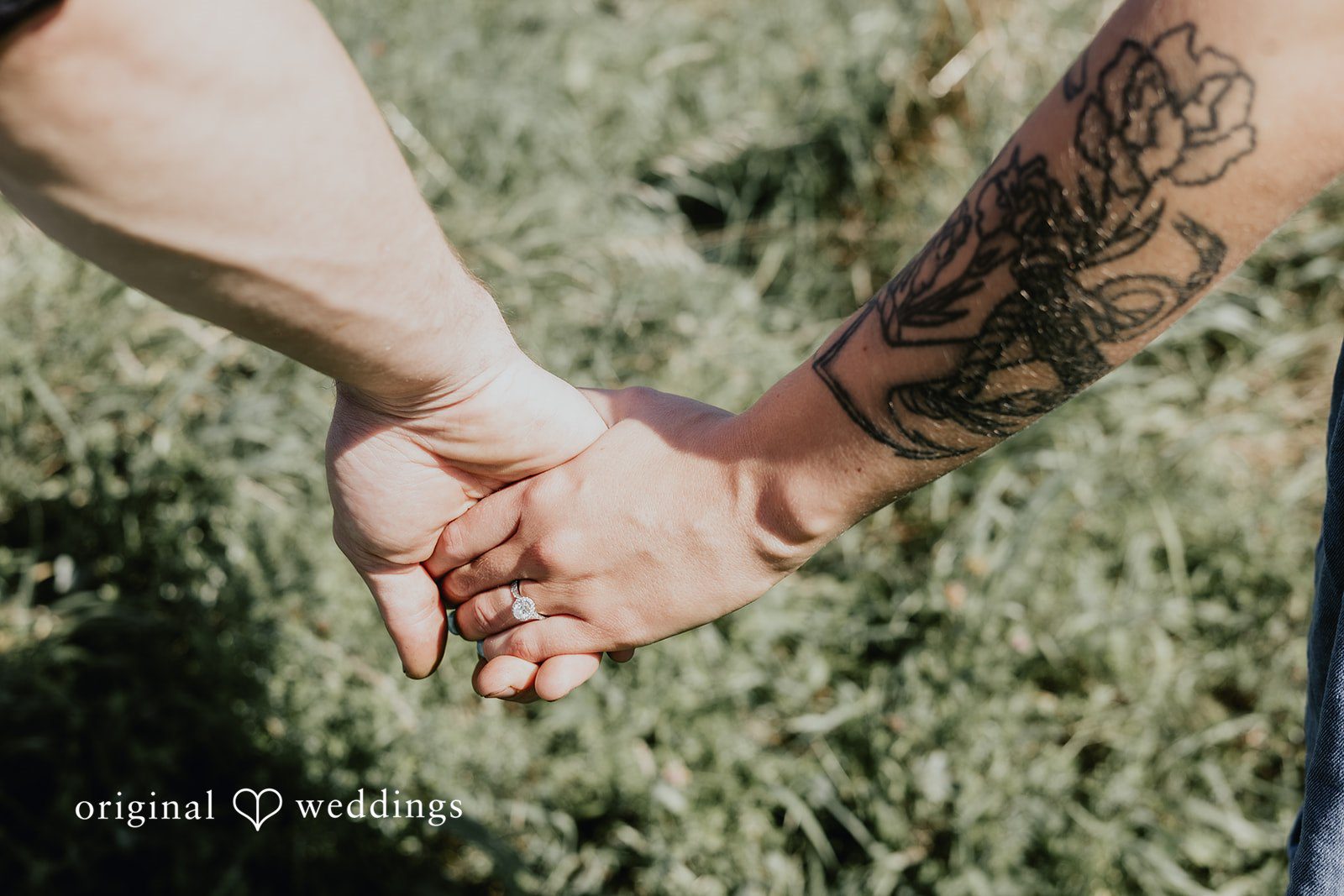 Meghan + Kal Couple hold hands with their fingers intertwined at Topsmead Forest.