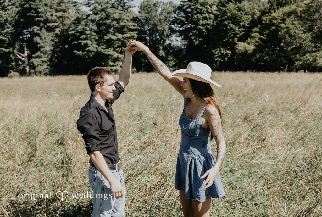 Meghan + Kal Engagement photography services by Original Weddings capturing close-up of couple with bride smiling at Topsmead Forest.
