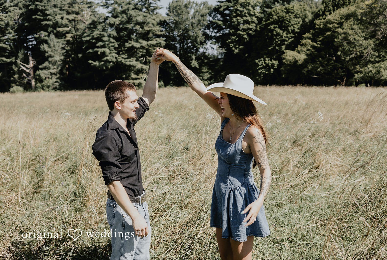 Engagement photography services by Original Weddings capturing close-up of couple with bride smiling at Topsmead Forest.