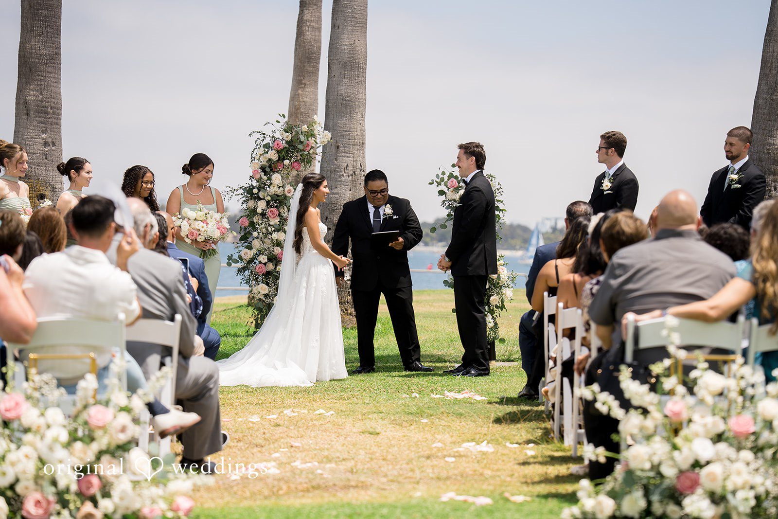 Kalina + Malakai A wide shot from behind the guest seating during the wedding ceremony.