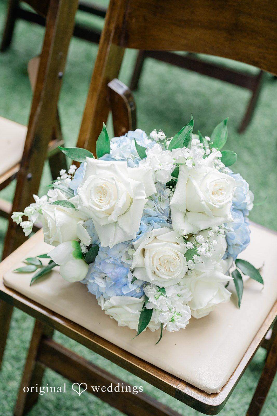 Destiny + Maksim A wedding centerpiece bouquet with white and light blue flowers.