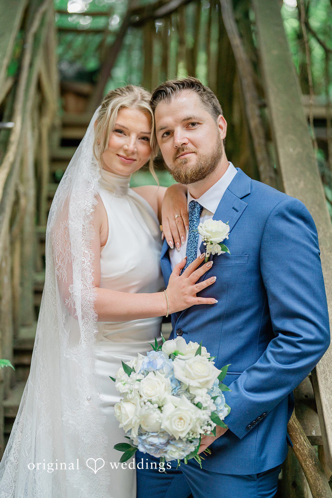 Destiny + Maksim A bride and groom smiling while posing together for a portrait.