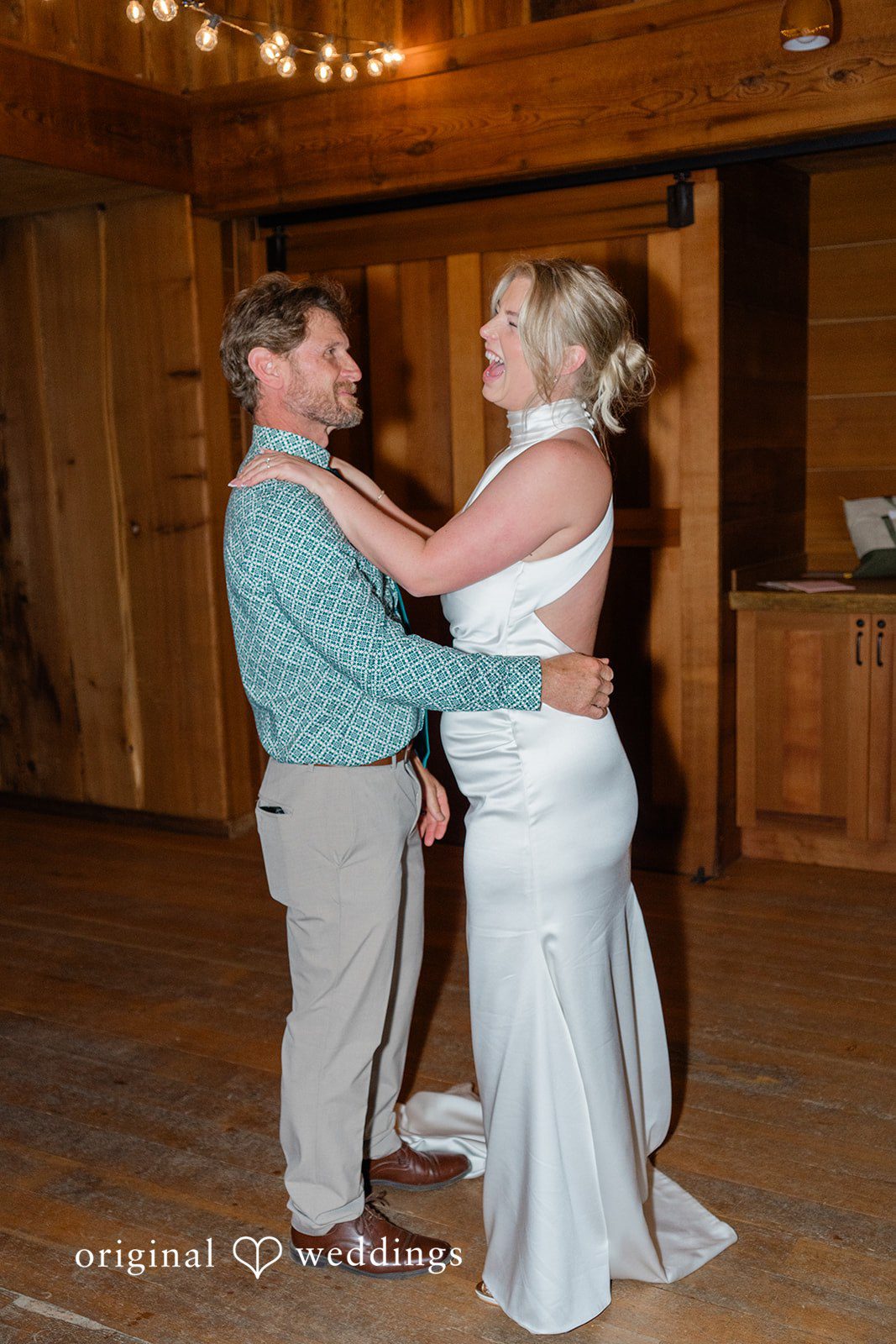 Destiny + Maksim A bride dancing with a man in a green button-down shirt.