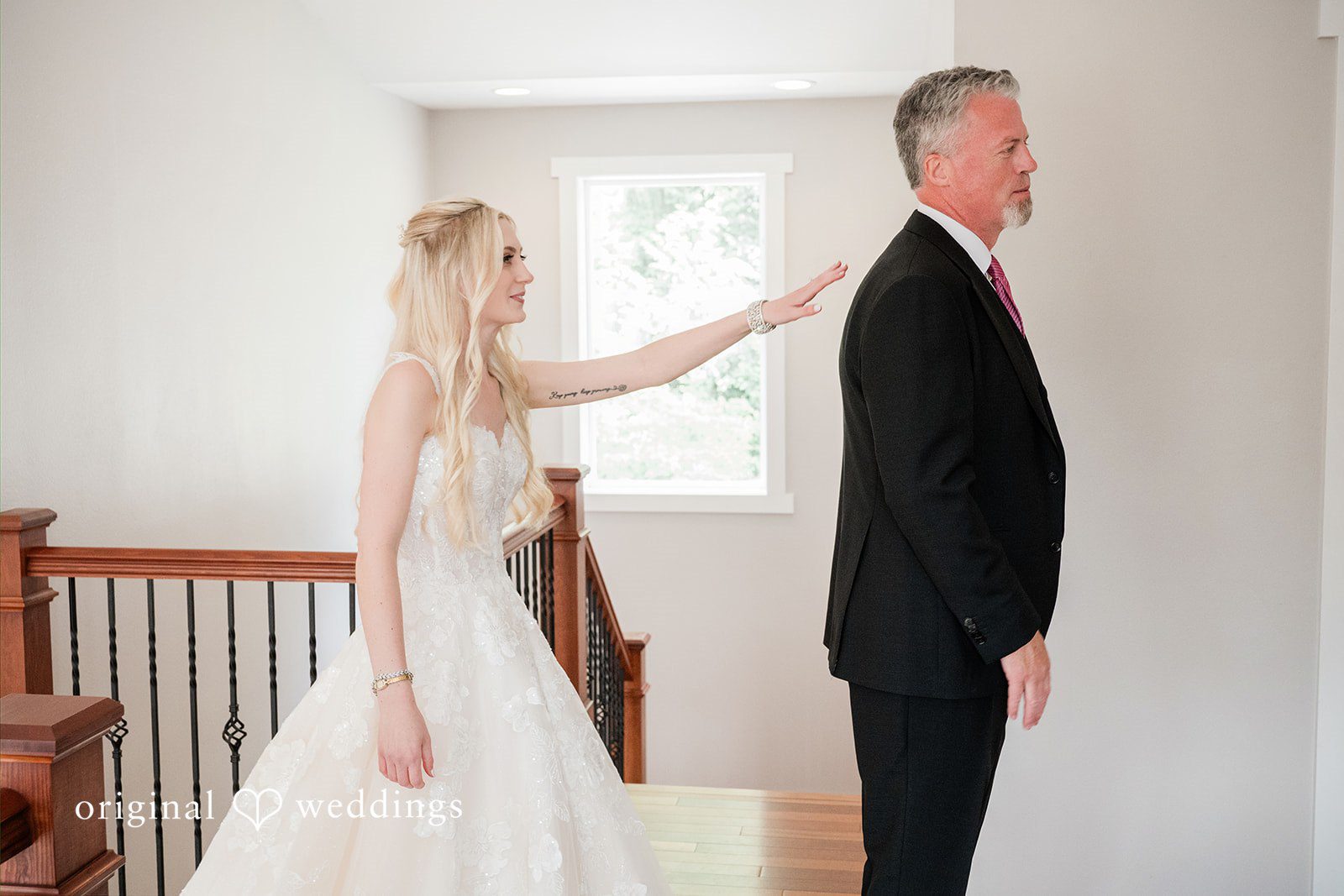 Luke + Kelsey A bride tapping a man on the shoulder from behind for a first look reveal.