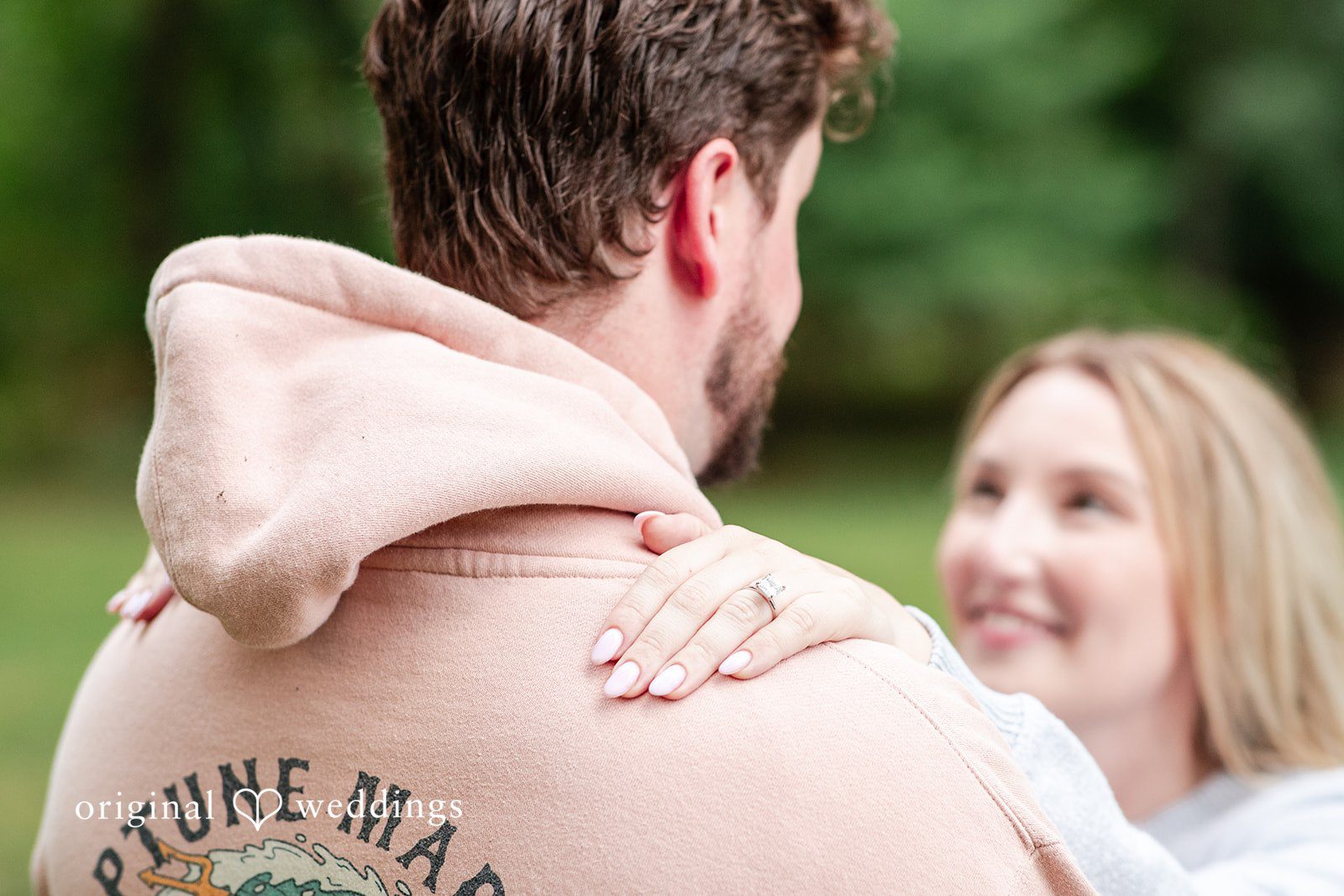 Sarah + Tyler A smiling couple stands closely together at Washington Crossing.
