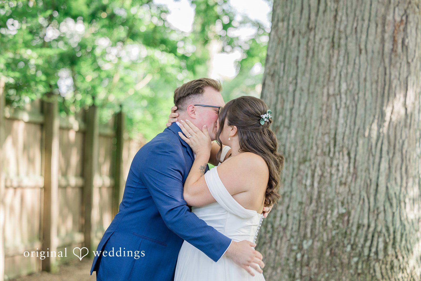 Emily + Joshua Newlyweds celebrating with a beautiful kiss after the ceremony.