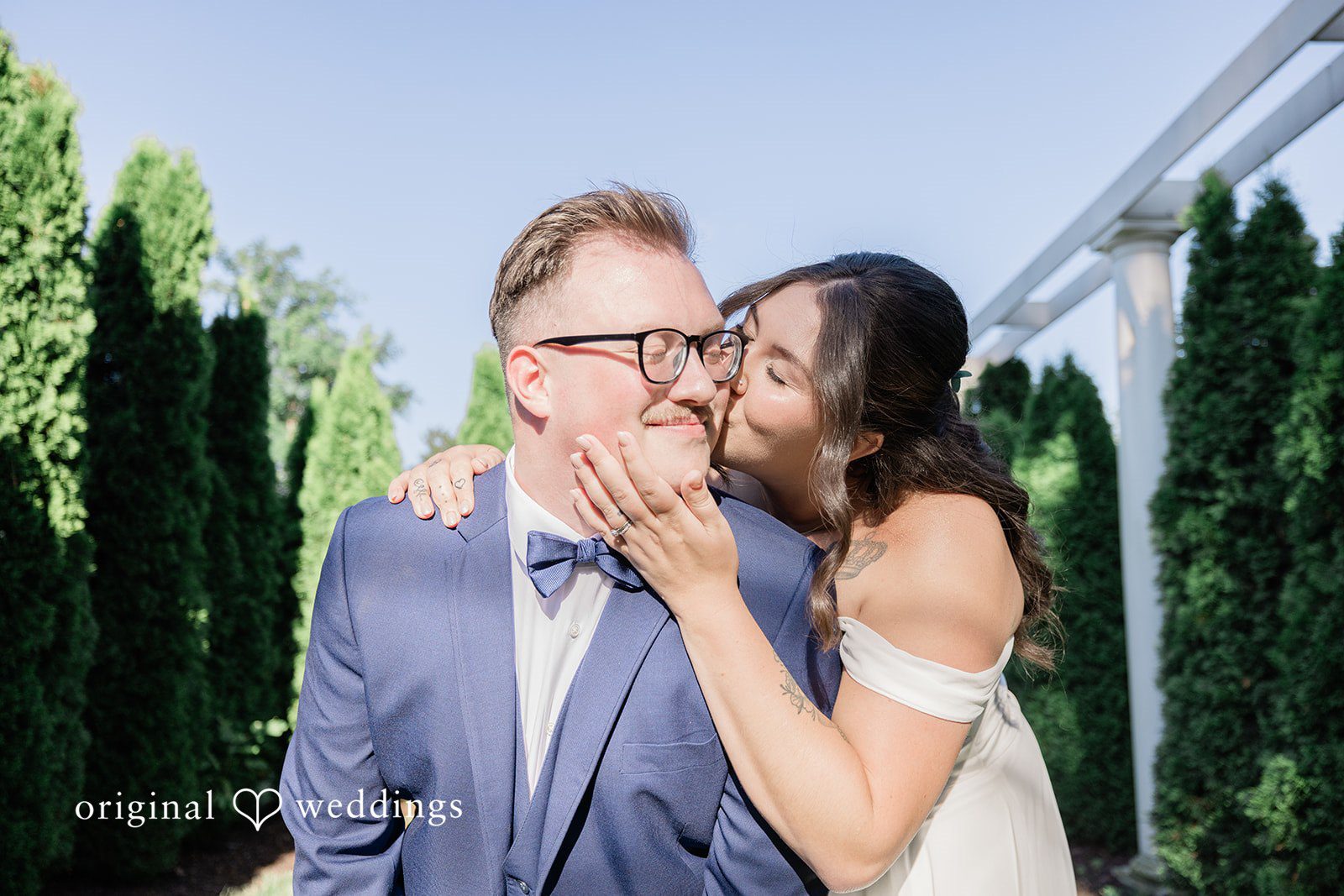 Emily + Joshua Bride sharing a romantic kiss at Whitehall Columbia captured by Cleveland Wedding Photographers from Original Weddings.