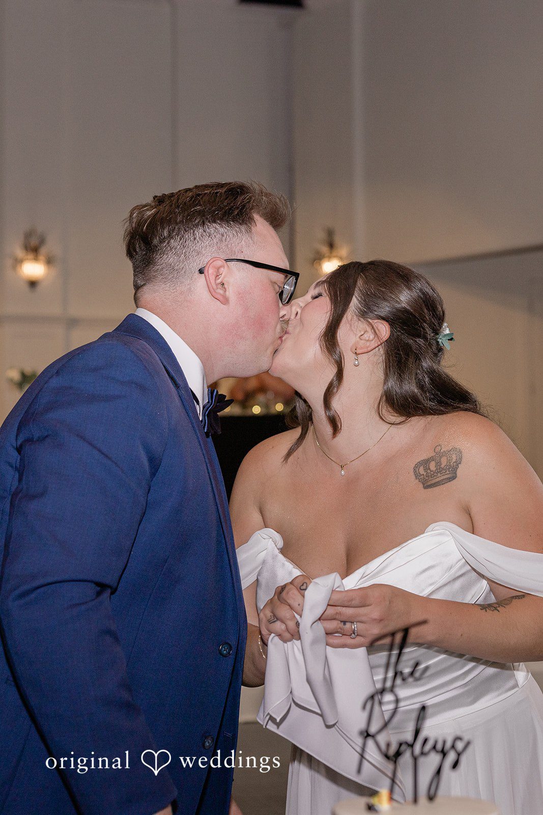 Emily + Joshua Newlyweds celebrating with a sweet kiss during the wedding reception at Whitehall Columbia.