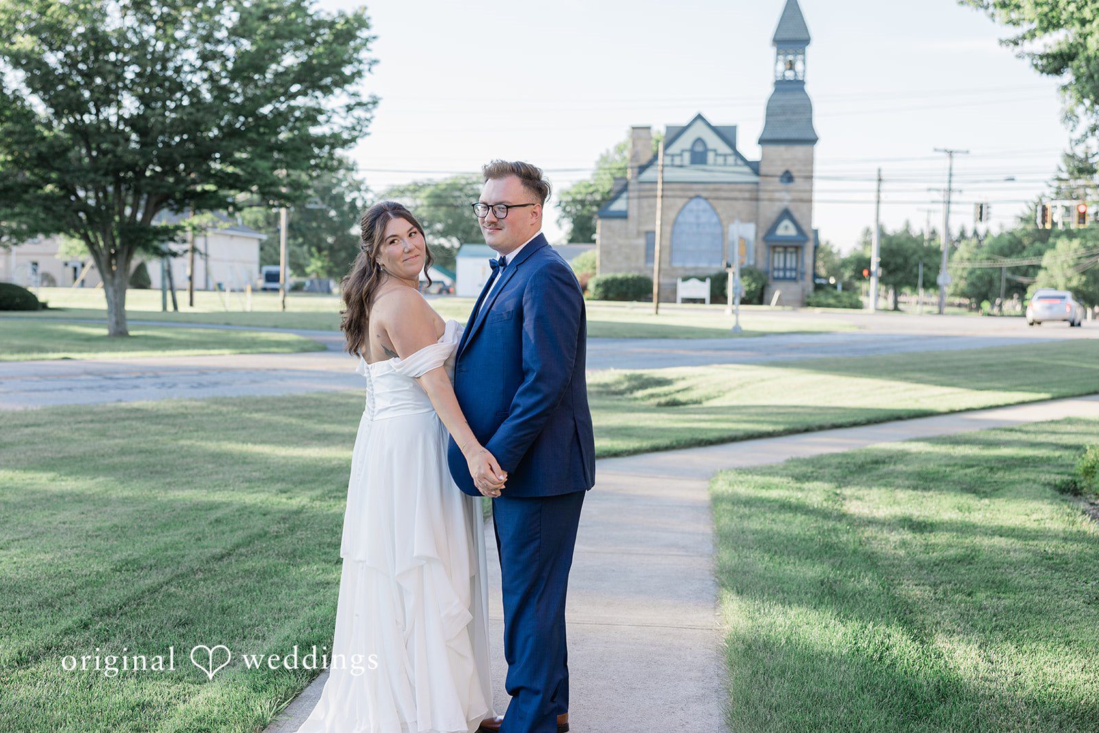 Emily + Joshua Romantic couple photoshoot while looking at the camera at Whitehall Columbia captured by Cleveland Wedding Photographers from Original Weddings.