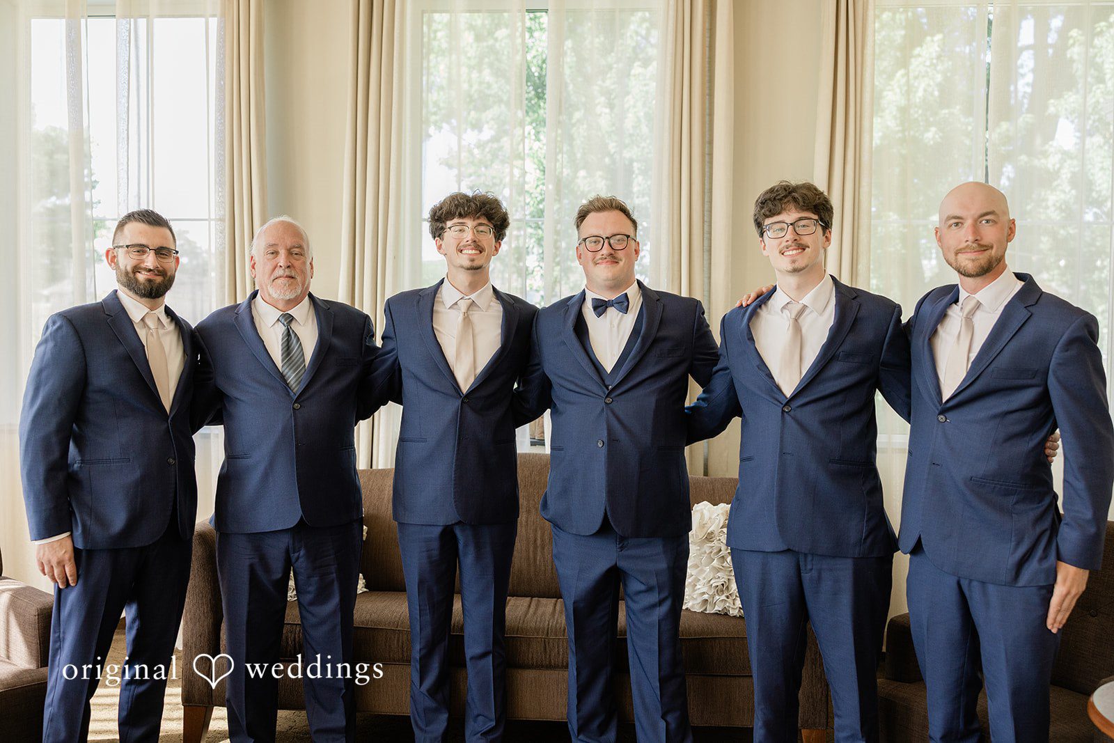 Emily + Joshua Groom and groomsmen posing together at Whitehall Columbia.