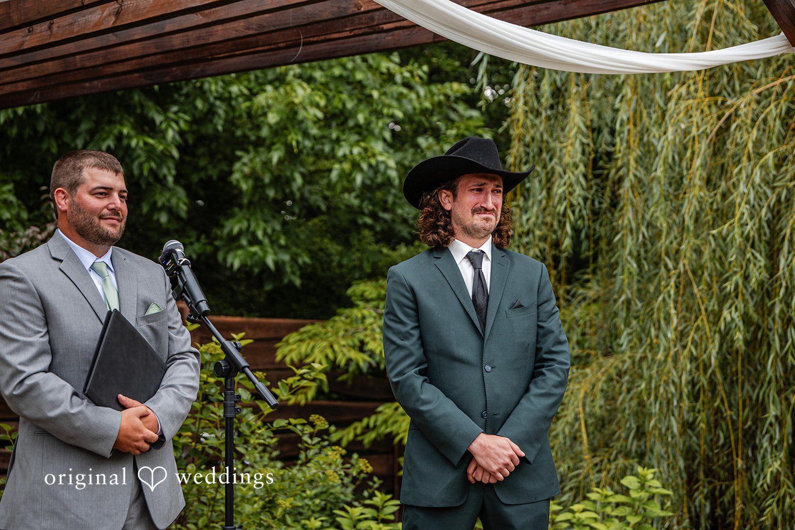 Savannah + Phillip An officiant and a groom standing at the altar waiting for the ceremony to begin.