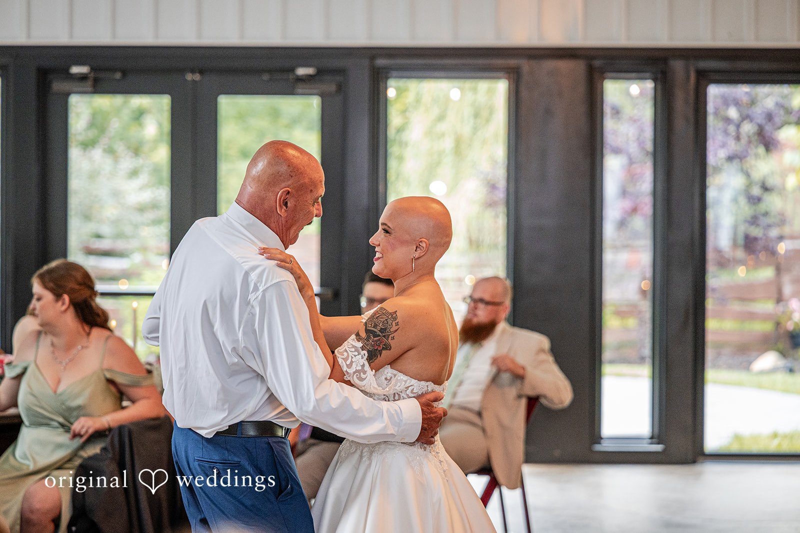 Savannah + Phillip A bride dancing with an older gentleman in a white shirt during a wedding reception.