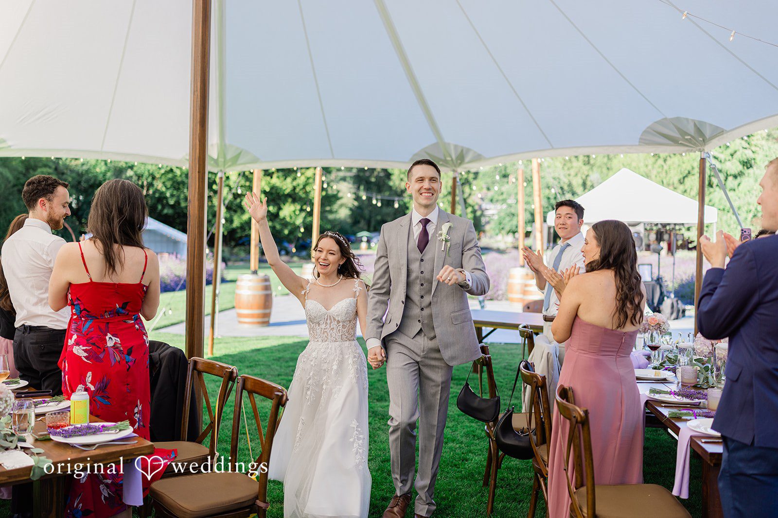Veronica + Andrew Wedding guests mingle under a large white tent during the reception.