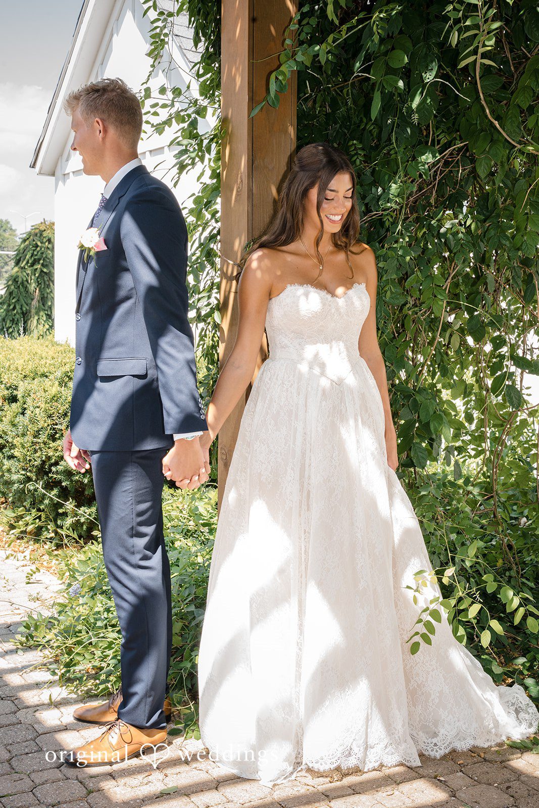 A bride and groom walk hand-in-hand down the aisle as husband and wife.