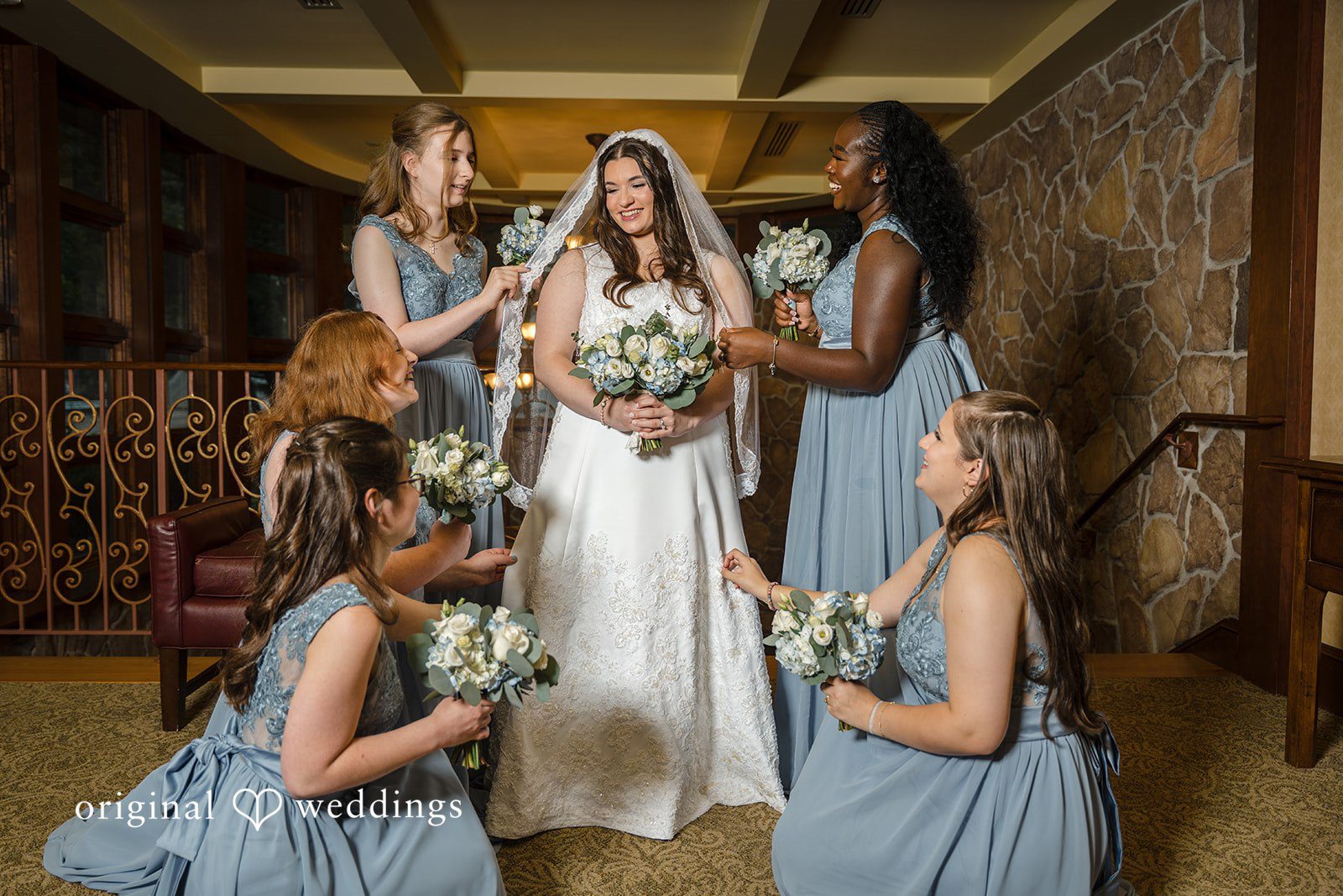 Ava + Zach A wedding ceremony with bridesmaids sitting down while the ceremony takes place.