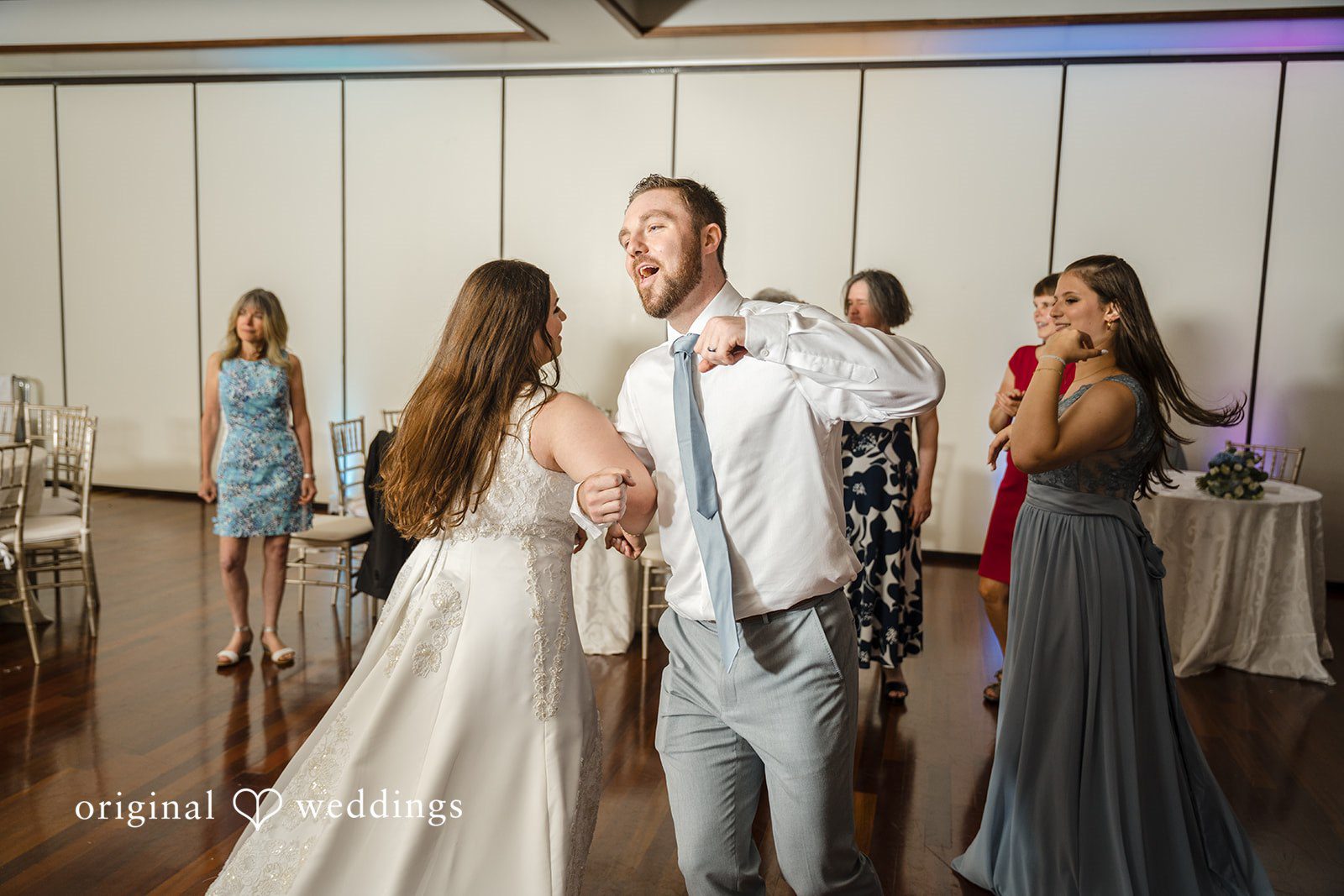 Ava + Zach A bride and groom dancing together at their wedding reception.